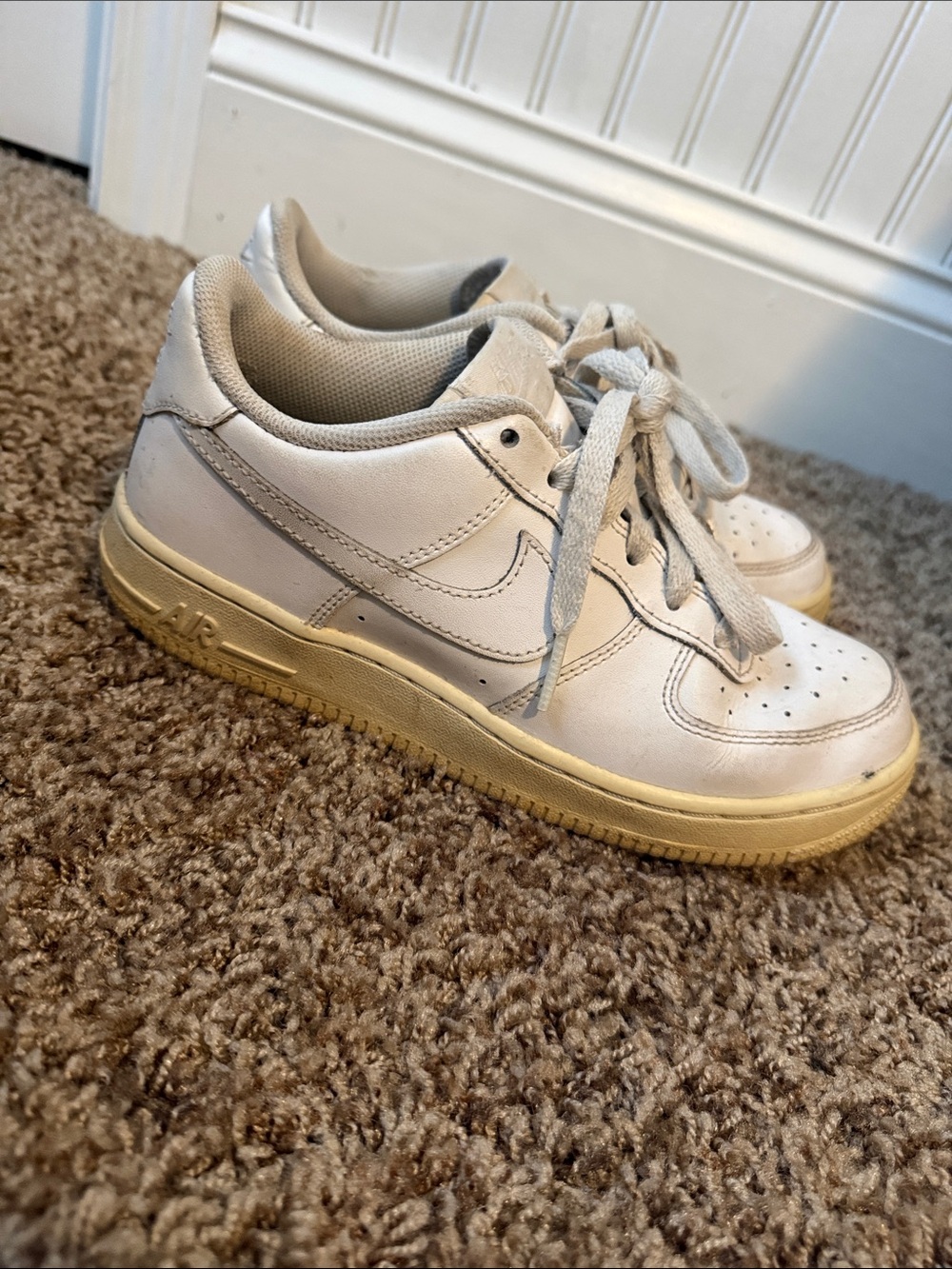 Nike Kids White Sneakers with Yellowed Sole. Fit me as a women’s 7.